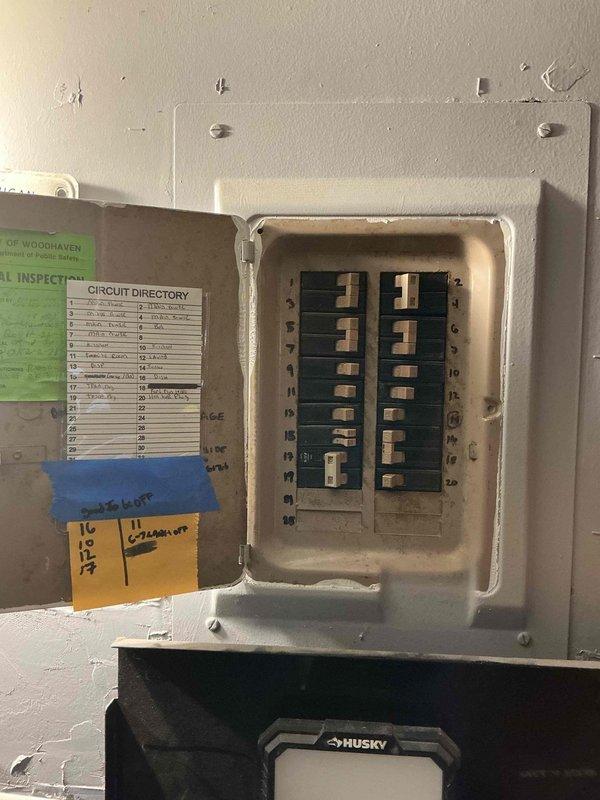 Responded to no-cooling complaint with warm air circulating from central air conditioning system. Upon arrival, inspected 2014 Goodman R4A3 series condensing unit (Model R4A330AKA200, Serial X141374778) rated for R-410A refrigerant at 208-230V AC. Accessed electrical panel to verify power supply and circuit integrity to outdoor unit. Documented equipment nameplate specifications and existing electrical distribution setup for diagnostic purposes. System requires further troubleshooting to identify root cause of loss of cooling capacity.