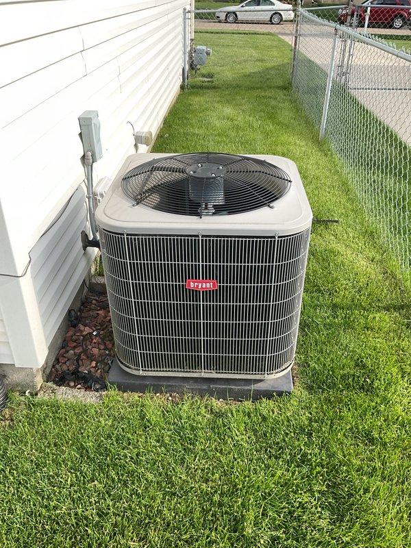 Completed comprehensive Gold AC inspection on 12-year-old residential cooling system with air handler located in basement. Performed thorough evaluation of outdoor condensing unit positioned on concrete pad, confirming proper operation of compressor, condenser fan motor, and electrical components. Inspected indoor air handler and evaporator coil assembly in basement, including Aprilaire humidifier control mounted on main supply duct. Verified refrigerant pressures, checked electrical connections, measured temperature differential across coil, and assessed overall system performance. Unit operating within manufacturer specifications with no immediate service needs identified at time of inspection.