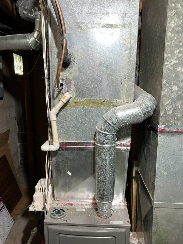 Completed comprehensive HVAC system replacement estimate for residential property. Assessed existing air handler unit installed in attic space with reflective insulation and basement furnace installation with galvanized ductwork, copper refrigerant lines, and PVC condensate drainage. Documented current equipment configuration, ductwork routing, and mechanical components to provide accurate replacement specifications for complete system upgrade.