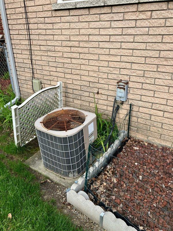 Provided comprehensive estimate for complete HVAC system replacement on a 20+ year old air conditioning unit experiencing inadequate cooling performance. The existing outdoor condenser unit, located in the backyard against the residence, had previously required capacitor replacement but has reached end of useful service life. Documented current equipment condition through photographs and presented replacement options to address the failing system.