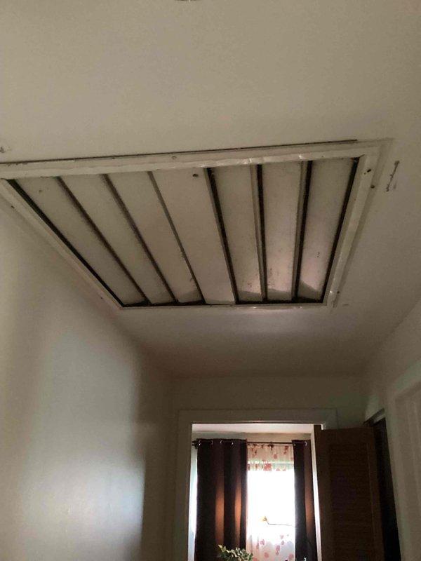Conducted site assessment for complete air conditioning system installation in home with no existing HVAC equipment. Evaluated two separate attic spaces requiring individual access points: one via bedroom closet serving three bedrooms and hallway, and second access point for living room, dining room, and kitchen areas. Inspected attic structural framing and access openings to determine ductwork routing feasibility. Reviewed electrical panel capacity and available circuit breaker positions to confirm adequate power supply for new system installation. Documented existing conditions including attic access dimensions, ceiling joist configuration, and electrical service specifications to prepare comprehensive equipment and ductwork estimate for full system installation.