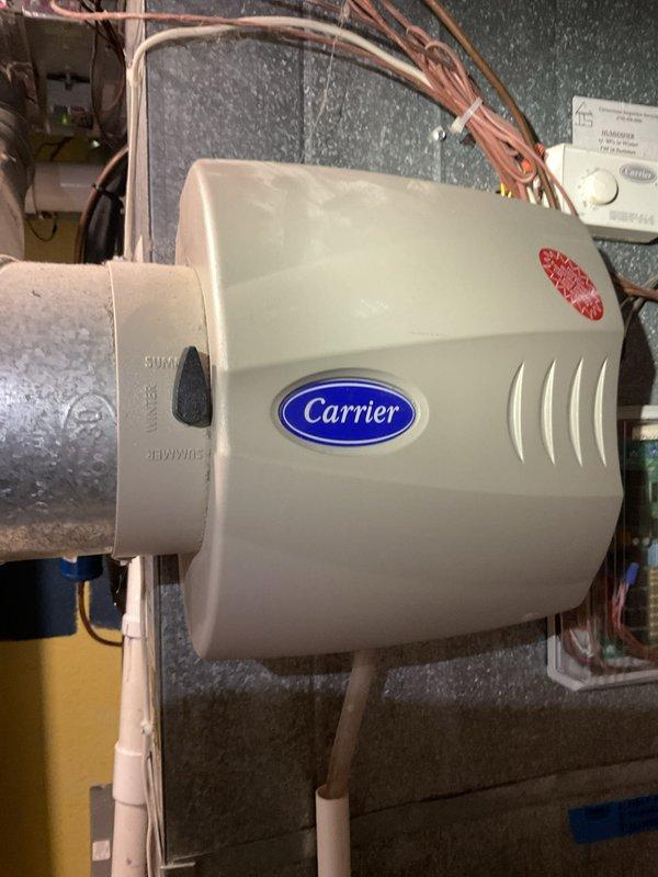 Completed comprehensive tune-up and city certification inspection on 13-year-old Carrier furnace system located in basement. Performed full system diagnostics, inspected evaporator coil assembly showing signs of dust accumulation, verified proper operation of Carrier humidifier unit and all refrigerant lines, confirmed all safety controls and electrical connections were secure, and validated system met municipal code requirements for certification.