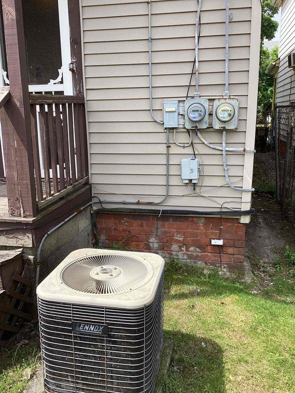 Performed on-site evaluation of 1999 Lennox air conditioning system with R22 refrigerant that was reported as empty. Inspected outdoor condensing unit mounted on exterior grade and assessed indoor coil located in basement. Based on equipment age exceeding 10 years, depleted refrigerant charge, and obsolete R22 refrigerant type, provided comprehensive replacement estimate for complete system upgrade to modern, efficient equipment with current refrigerant technology.