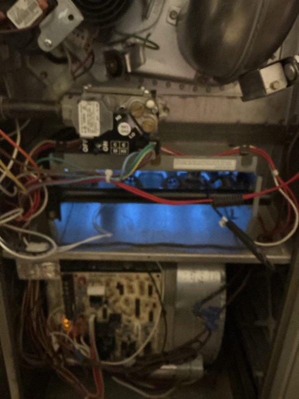Completed comprehensive Gold AC Inspection on residential property with three HVAC units including 10+ year old air conditioning and furnace systems, plus 9-year-old Honeywell 11kW generator. Performed thorough inspection of outdoor condenser unit, verifying proper operation of fan motor, compressor, and condenser coils. Inspected indoor air handler components in basement location, including blower motor assembly, capacitor, relay/contactor, and electrical connections. Verified all colored wiring connections secure and properly terminated. Confirmed equipment operational and functioning as designed at time of inspection. Documented system condition with photographs showing internal electrical components, capacitor, blower assembly, and external condenser unit condition. Customer provided two furnace filters and one humidifier pad due to previous scheduling conflict.