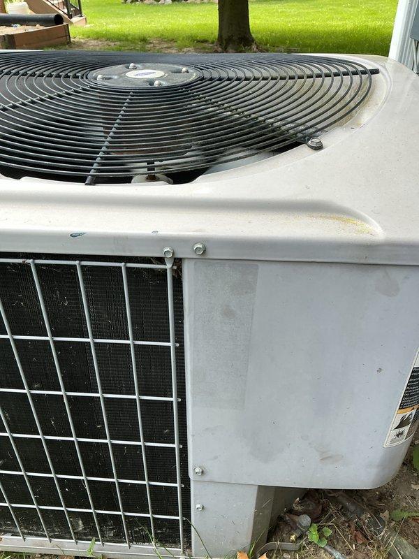 Completed comprehensive Gold AC Inspection on residential property with three HVAC units including 10+ year old air conditioning and furnace systems, plus 9-year-old Honeywell 11kW generator. Performed thorough inspection of outdoor condenser unit, verifying proper operation of fan motor, compressor, and condenser coils. Inspected indoor air handler components in basement location, including blower motor assembly, capacitor, relay/contactor, and electrical connections. Verified all colored wiring connections secure and properly terminated. Confirmed equipment operational and functioning as designed at time of inspection. Documented system condition with photographs showing internal electrical components, capacitor, blower assembly, and external condenser unit condition. Customer provided two furnace filters and one humidifier pad due to previous scheduling conflict.