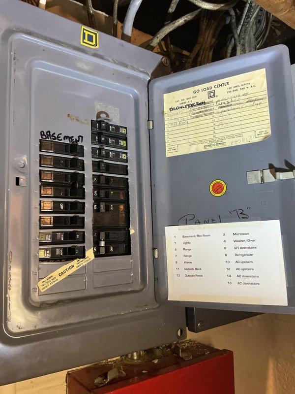 Responded to no cooling call on recently installed downstairs air conditioning system that would not turn on. Upon arrival, inspected residential HVAC installation in basement consisting of furnace and air handler with associated ductwork and PVC condensate piping. Investigated electrical panel labeled "Panel B" and reviewed circuit assignments for both upstairs and downstairs AC units. Identified circuit breaker issue affecting downstairs air conditioning unit power supply. Reset tripped breaker on circuit serving downstairs AC system and verified proper electrical connection to equipment. Tested system operation and confirmed downstairs air conditioning unit powered on successfully and began cooling cycle. System returned to normal operation with proper airflow through ductwork and equipment functioning as designed.