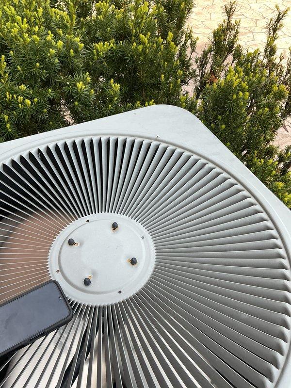 Completed comprehensive Gold AC inspection on single outdoor condenser unit located on patio adjacent to basement air handler. Performed full system evaluation including visual inspection of condenser coils, fan assembly, and electrical components. Verified proper operation of all mechanical systems, checked refrigerant levels, inspected condensate drainage, and confirmed adequate airflow throughout unit. Exterior condenser housing and fan grille found in good condition with no visible damage or excessive wear. Unit surrounded by landscaping maintained clear of debris to ensure optimal airflow and system efficiency. All components operating within normal parameters at time of inspection.