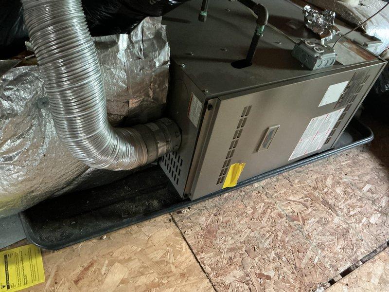 Completed full system HVAC estimate for property with no existing air conditioning. Assessed attic space and existing infrastructure to provide options for both traditional central air conditioning system and ductless mini-split installation. Documented current conditions including attic accessibility, available space for equipment placement, electrical service capacity, and optimal locations for indoor and outdoor unit installation. Photographed existing heating system air handler and ductwork configuration to determine compatibility with proposed cooling solutions. Evaluated insulation requirements, condensate drainage routing, and refrigerant line pathways for both system types to provide comprehensive installation proposals.
