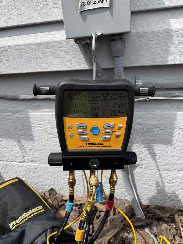 Completed comprehensive tune-up and inspection on two 7-year-old residential air conditioning systems. Performed refrigerant pressure diagnostics using digital manifold gauges on both outdoor condensing units, verifying proper system charge levels and operating pressures. Inspected refrigerant line sets, service valves, insulation integrity, and electrical disconnect components at both outdoor units, confirming all connections secure and system components functioning within normal parameters.