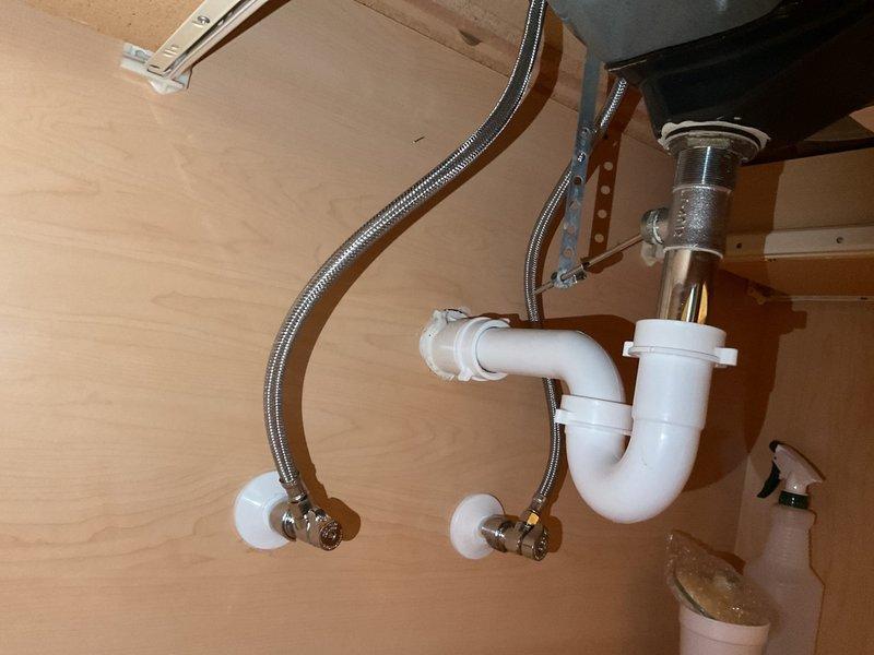 Responded to service call for leak detection and moisture assessment in residential condo unit. Performed comprehensive inspection of plumbing fixtures and water supply connections in bathroom and kitchen areas. Examined toilet water supply line, shut-off valve, and flexible braided connection for signs of leakage or deterioration. Inspected under-sink plumbing including P-trap assembly, drain connections, and dual braided stainless steel supply lines with chrome shut-off valves. Tested all connections for active leaks and checked surrounding areas for moisture intrusion or water damage. Documented all plumbing fixtures and connections with photographic evidence. Provided repair recommendations and prepared two quote options for necessary corrective work totaling required repairs and preventive maintenance measures.