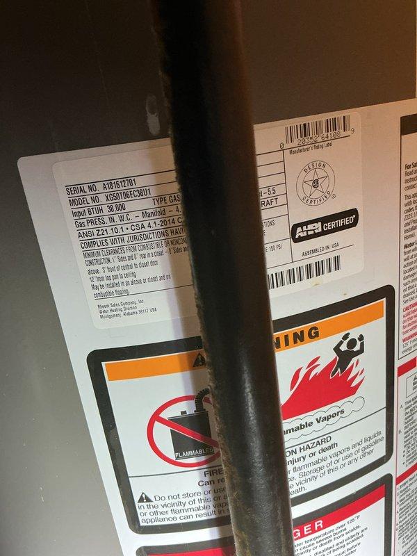 Responded to service call for burning smell when AC system is turned on at new residence. Upon inspection, identified Rheem gas furnace (Model KG50T100CELM1, Serial A161K12701) with central air conditioning system located in unfinished basement. System was operational and cooling properly despite odor complaint. Conducted thorough visual inspection of air handler, ductwork, and humidifier assembly. Documented equipment specifications and current condition with photos. Burning smell is consistent with dust accumulation on heat exchanger from furnace sitting idle during warmer months, which typically dissipates after initial AC usage. Verified all electrical connections secure, ductwork properly sealed, and no visible signs of overheating or component failure. Advised that odor should resolve naturally with continued operation, but to contact immediately if smell persists or worsens.