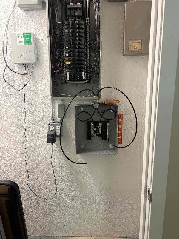 Completed mini split system installation over two-day period with full mechanical and electrical integration. Installed new dedicated electrical circuit with breaker panel modifications to support mini split system requirements, ensuring proper power supply and code compliance. All equipment mounted, leveled, and tested for proper operation with electrical connections verified and secured.