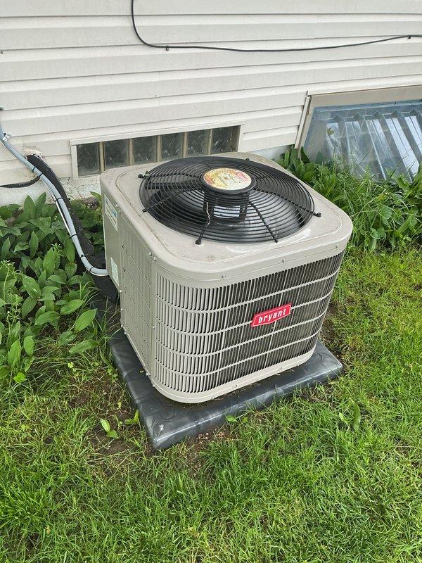 Completed comprehensive Gold AC Inspection on 8-year-old residential air conditioning system with air handler located in basement. Performed full system evaluation including condenser unit inspection, verified operational status, and documented equipment condition through photographic records. Advised customer that condenser area requires clearing of debris and animal waste to maintain proper airflow and system efficiency.