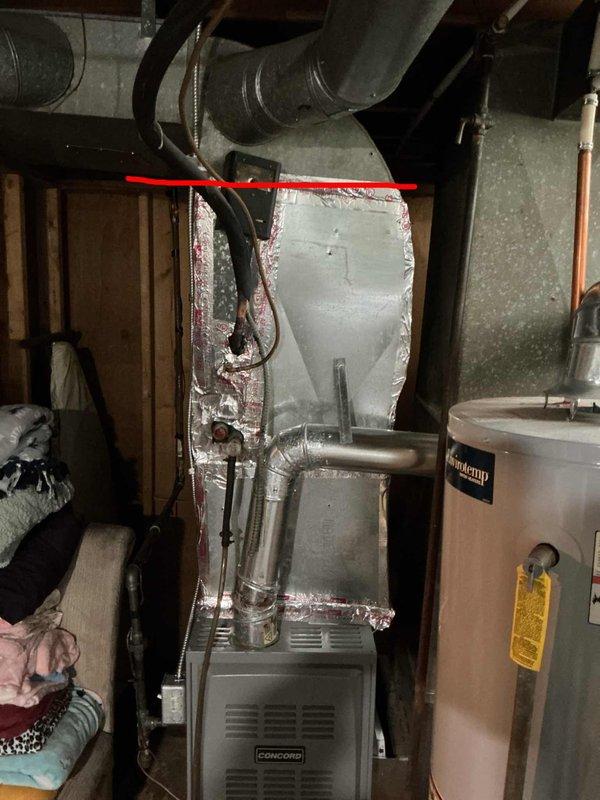 Responded to customer report of air conditioning system not cooling the residence. Upon arrival, inspected 10+ year old HVAC system with evaporator coil located in basement. Evaluated Concord furnace unit and associated ductwork, examined electrical panel and circuit breaker configuration serving the cooling equipment, and assessed overall system condition including refrigerant lines and mechanical connections. Documented equipment specifications and installation layout to provide comprehensive replacement estimate for aging air conditioning system.