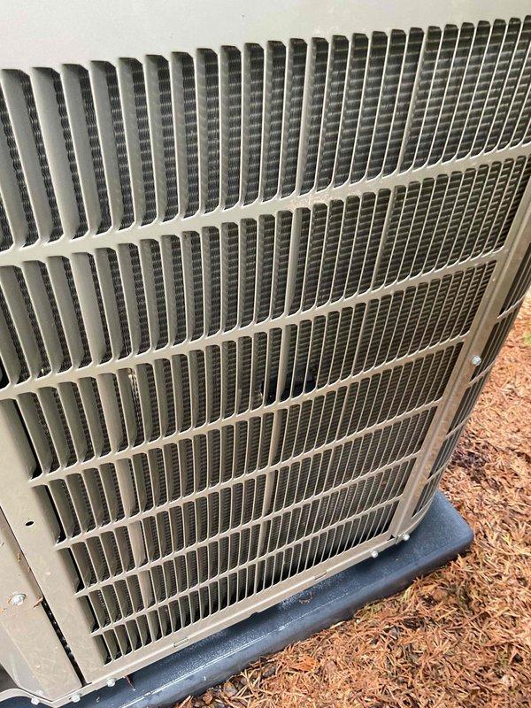Completed Gold AC Inspection on a 7-year-old Bryant air conditioning system. Performed comprehensive evaluation of outdoor condenser unit, which showed normal weathering consistent with age but remained in functional condition. Verified system operation, inspected heat exchanger coils and fins for proper airflow, checked refrigerant lines, and confirmed unit stability on concrete pad. Noted minor debris accumulation on top grille and surrounding area, typical for outdoor equipment. All components operating within normal parameters at time of inspection.