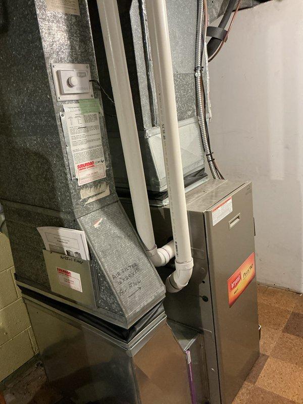 Conducted comprehensive HVAC replacement estimate for 20-year-old air conditioning system experiencing low refrigerant levels and inadequate cooling performance. Upon inspection of the basement-installed equipment, determined that repair costs would be prohibitively high given the age and condition of the existing system, with visible dust accumulation and wear on components. Provided detailed replacement options and specifications for new high-efficiency system to restore proper cooling capacity and improve overall system performance.