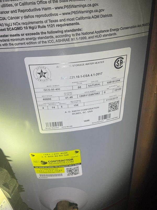 Completed Gold AC Inspection on 13-year-old air conditioning system with air handler/coil located in basement. Performed comprehensive inspection of all system components, verified operational status of AC unit, and inspected condenser area. Advised property owner that debris should be cleared from around outdoor condenser unit to maintain proper airflow and system efficiency. Provided air filters as requested and documented existing equipment including General brand humidistat control panel and 50-gallon A.O. Smith natural gas water heater (model GCG-50 400).