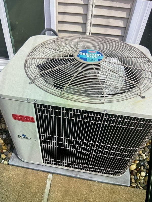Completed comprehensive Gold AC Inspection on 22-year-old Bryant Puron system with outdoor condensing unit and air handler located at backdoor access. Performed full system evaluation including temperature differential measurements, visual inspection of condenser unit and fan assembly, and operational testing confirming system functionality with discharge air temperature reading of 74.3°F. Advised customer to maintain clear area around condenser unit, removing any debris and animal waste to ensure proper airflow and system efficiency.