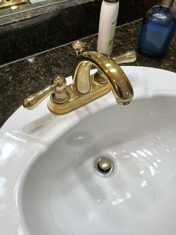 Responded to service call for multiple plumbing repairs. Replaced broken under-sink mounting bracket to secure vanity basin and restore structural support. Removed existing shower head and installed new handheld shower fixture with flexible stainless steel hose and wall-mounted holder bracket on tiled shower wall. Inspected toilet tank assembly and adjusted flapper chain length to ensure proper seating and seal, eliminating continuous running water and preventing tank overflow condition. Tested all repairs for proper operation and verified no leaks present at connections.