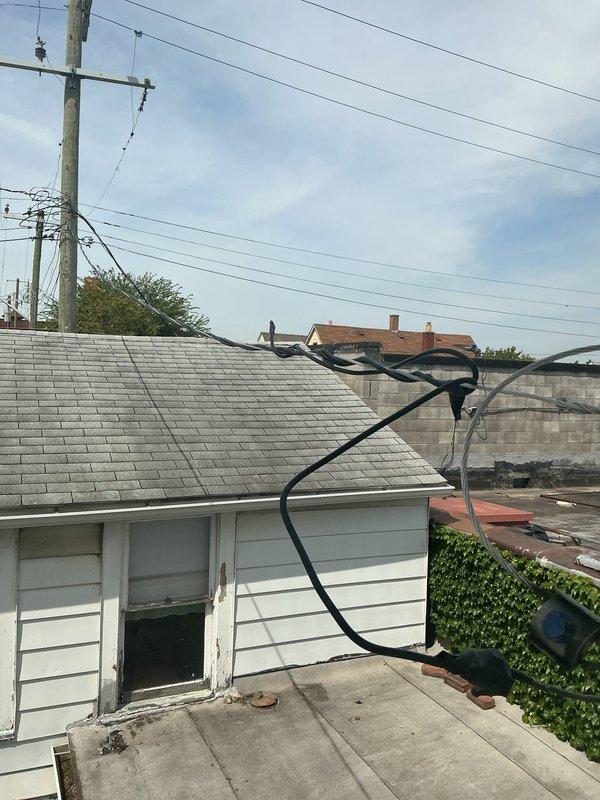 Replaced service entry cable from utility connection point to building, installing new conduit routing across roofing structure to main electrical panel. Replaced defective hallway light switch wiring, securing new conductor and installing updated switch mechanism with proper grounding. Installed GFCI receptacle in laundry room per code requirements, ensuring proper ground fault protection for wet location.