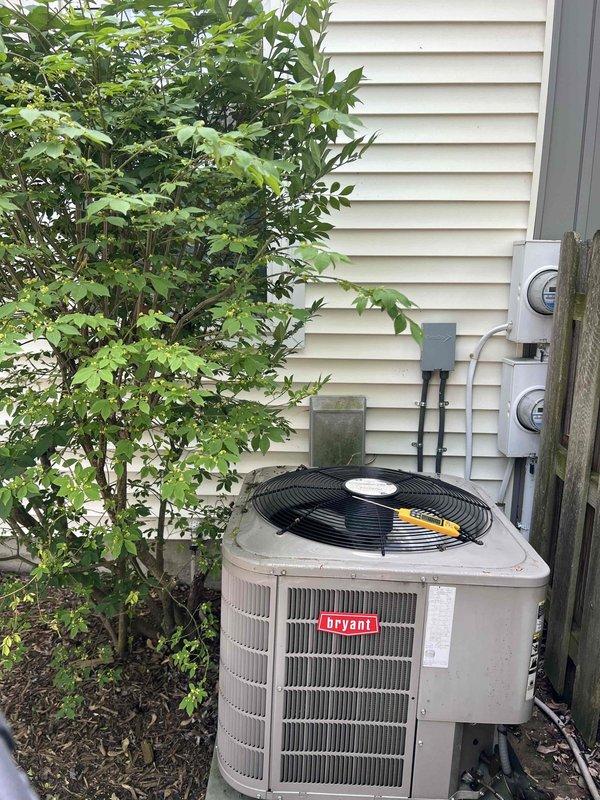 Completed comprehensive Gold AC inspection on 16-year-old Bryant air conditioning unit located at residential property. Performed full system evaluation including refrigerant pressure checks, electrical component testing, condenser coil inspection, and fan motor operation verification. Unit found to be operating within normal parameters with no immediate service needs identified. Confirmed proper airflow through condenser coils and verified electrical connections at outdoor disconnect and power supply. Documented equipment condition with photographic records showing unit positioned on concrete pad with adequate clearance from surrounding landscaping and utility infrastructure.