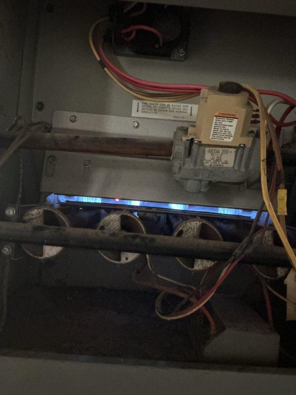 Performed routine maintenance tune-up on a gas furnace less than 5 years old located in basement. Conducted comprehensive inspection of all system components including gas valve, burner assembly, and electrical connections. Verified proper ignition sequence and observed clean blue flame pattern across burner ports, indicating optimal combustion. Inspected and replaced 16x25x1 air filter which showed dust accumulation. Checked all wiring connections, tested safety controls, and confirmed unit operating within normal parameters. No deficiencies or repairs required at this time.
