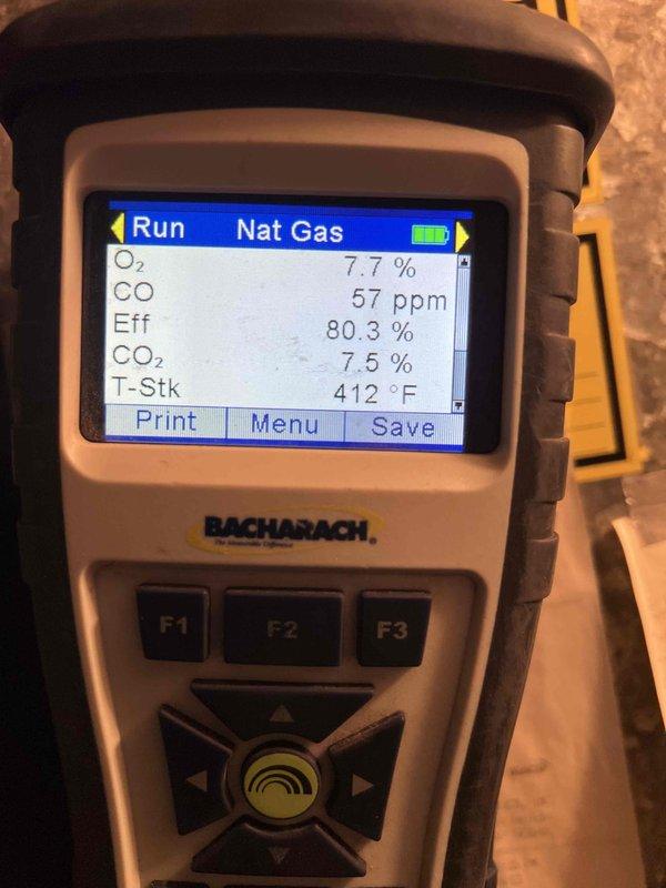 Completed Gold Furnace Inspection on 19-year-old natural gas furnace located in basement. Performed combustion analysis using Bacharach analyzer, recording stack temperature of 412-442°F, oxygen level of 7.7%, carbon dioxide at 7.5%, carbon monoxide at 57-90 ppm, and combustion efficiency at 80.3%. Unit confirmed operational with all safety systems functioning properly. Special Carrier filter available at Carrier Madison Heights under PO: 1322269-001 for future maintenance needs.