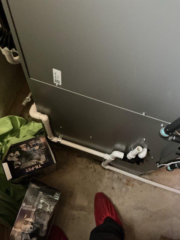 Completed AC system start-up and verification on basement air handler installation with evaporator coil. Performed operational testing of new equipment, confirmed proper function of APCO air purification system with active LED display, and verified all drainage piping connections and condensate line routing. System operating within manufacturer specifications with all components functioning correctly.
