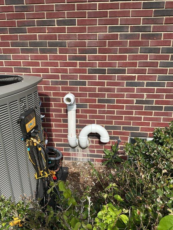 Completed full HVAC system installation including a 110,000 BTU furnace, 4-ton air conditioning unit, and whole-home humidifier. Positioned condensing unit in right side yard against brick exterior wall with proper clearances, installed PVC venting through wall with appropriate trap configuration, and coordinated electrical service upgrades with licensed electrician for system power requirements. Performed system startup, charged refrigerant lines to manufacturer specifications using manifold gauges, reconnected all utilities, and verified proper operation of all heating, cooling, and humidification components.