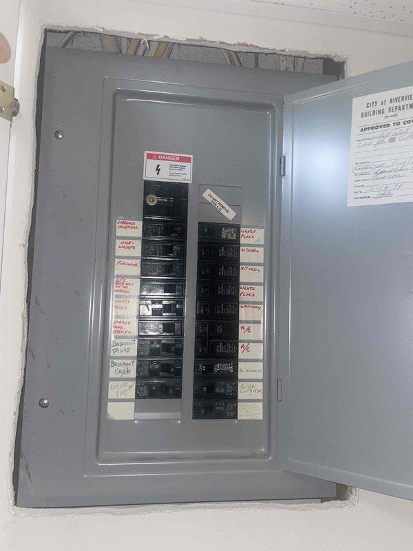 Responded to service call for thermostat malfunction where heating system operated normally but air conditioning would not activate. Conducted diagnostic assessment of 10+ year old AC system and existing thermostat of unknown age located in basement. Evaluated electrical panel configuration and circuit connections serving HVAC equipment. Inspected Carrier furnace unit and associated ductwork with seasonal damper controls in utility space. Documented existing equipment conditions and electrical service setup. Provided estimate for AC system replacement based on equipment age, operational failure of cooling function, and homeowner's service requirements.
