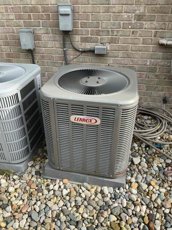 Completed comprehensive Gold AC Inspection on 13-year-old Lennox air conditioning system with air handler located in basement. Performed full system evaluation including refrigerant pressures, electrical connections, condenser coil inspection, and operational testing. Noted exterior corrosion and rust on lower front panel of outdoor condenser unit requiring monitoring for potential future panel replacement to prevent further deterioration.