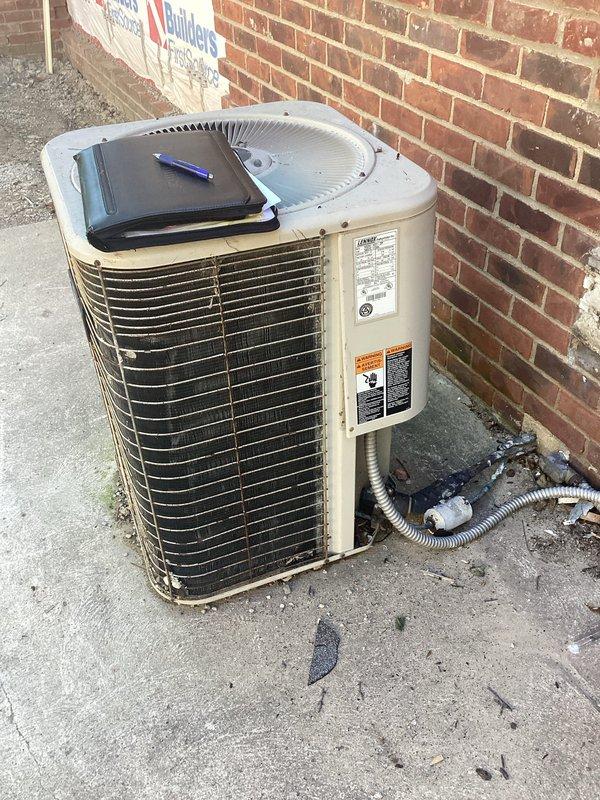 Responded to service call for air conditioning system blowing warm air. Upon inspection, found 1997 outdoor condensing unit with critically low R22 refrigerant levels, indicating potential leak in aged system. Given the age of the equipment, refrigerant phase-out concerns, and cost-effectiveness of repairs versus replacement, provided comprehensive estimate for complete HVAC system replacement including new condensing unit and associated components.