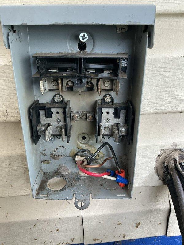 Responded to no-cooling call where indoor unit powered on but outdoor condenser and fan remained inoperative. Previous technician had already replaced capacitor and contactor without resolving the issue. Upon inspection, identified electrical supply problem at outdoor disconnect requiring licensed electrician to diagnose and repair wiring or circuit concerns before HVAC system can be restored to operation.