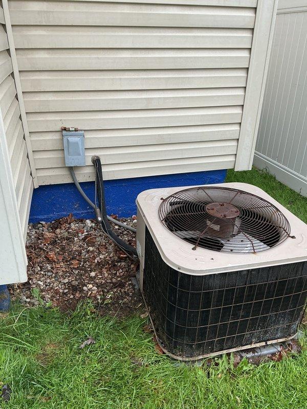 Responded to no-cooling call where indoor unit powered on but outdoor condenser and fan remained inoperative. Previous technician had already replaced capacitor and contactor without resolving the issue. Upon inspection, identified electrical supply problem at outdoor disconnect requiring licensed electrician to diagnose and repair wiring or circuit concerns before HVAC system can be restored to operation.