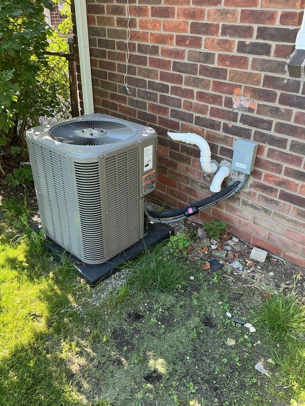 Completed general preventative AC inspection on residential split system less than one year old. Inspected indoor evaporator coil located in basement mechanical room and outdoor condensing unit positioned on pad against exterior brick wall. Verified proper operation of furnace/air handler, checked refrigerant line connections, confirmed condensate drain lines are clear and functioning, and inspected electrical connections at both indoor and outdoor units. All components found to be in good working order with no immediate service needs identified. System operating within normal parameters for equipment of this age.