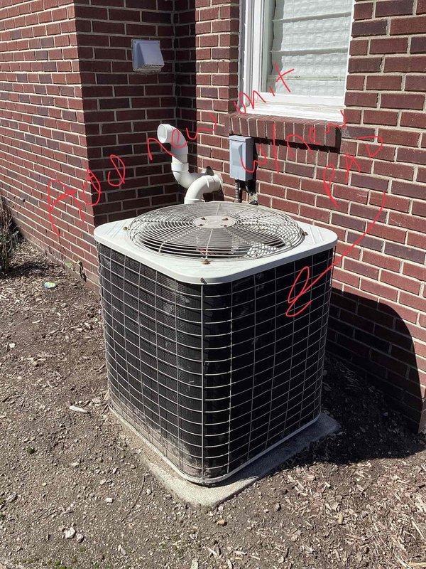 Conducted site assessment for complete HVAC system replacement of 26-year-old non-operational air conditioning unit and natural gas furnace located in basement. Evaluated existing outdoor condenser unit positioned on concrete pad against brick exterior, assessed indoor ductwork configuration and sheet metal distribution system, and documented current equipment specifications and installation requirements for full system replacement estimate.