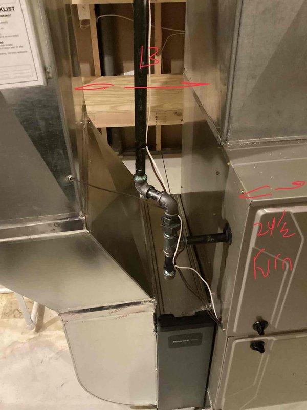Conducted site assessment for complete HVAC system replacement of 26-year-old non-operational air conditioning unit and natural gas furnace located in basement. Evaluated existing outdoor condenser unit positioned on concrete pad against brick exterior, assessed indoor ductwork configuration and sheet metal distribution system, and documented current equipment specifications and installation requirements for full system replacement estimate.