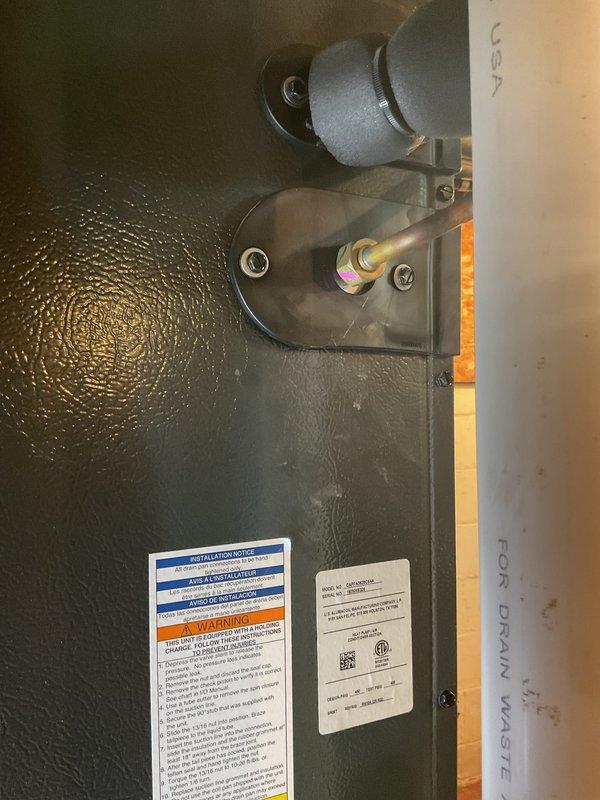 Completed comprehensive Gold AC inspection on 6-year-old residential air conditioning system with outdoor condenser unit and basement-located air handler. Performed multi-point inspection including visual assessment of condenser cabinet condition, refrigerant line connections, electrical components, and condensate management system. Unit confirmed operational at time of service. Noted exterior cabinet showing weather-related discoloration and vegetation growth around perimeter requiring attention for optimal airflow and longevity. Documented all equipment conditions and component configurations through photographic records for maintenance history.