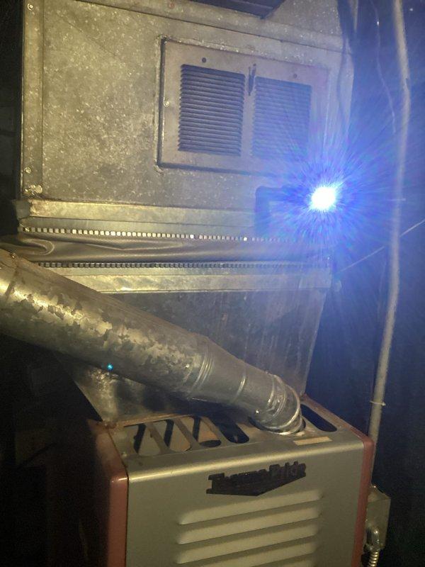 Conducted on-site evaluation for complete HVAC system replacement including non-operational air conditioning condenser unit located on exterior concrete pad and natural gas furnace installed in basement. Assessed existing equipment configuration, documented current system conditions through photographic inspection, and gathered necessary specifications to prepare comprehensive replacement estimate for both heating and cooling components.