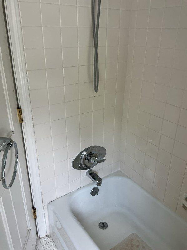 Replaced faulty shower valve and hose bib assembly in bathroom. Accessed plumbing infrastructure through wall cavity, removed existing corroded copper piping and brass valve fittings, and installed new chrome shower fixture with single-handle faucet control and tub spout. Completed installation with proper sealing and tested system for leaks to ensure proper water flow and temperature control.