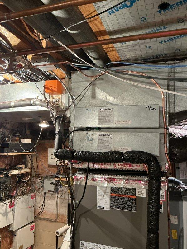 Installed shut off valve and cap for humidifier water supply line in basement mechanical room. Connected brass valve to existing copper piping near HVAC system to provide isolation capability for humidifier maintenance and winterization. All connections tested and verified leak-free upon completion.