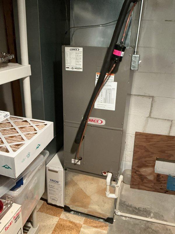 Completed comprehensive Gold AC inspection on two-unit residential HVAC system consisting of a 25-year-old unit and a 12-year-old Lennox air handler located in basement. Performed complete system evaluation including refrigerant line inspection, condensate drainage check via white PVC piping, air filter assessment, and verification of operational status on both units. All equipment confirmed to be in working condition at time of inspection, with humidifier and ductwork connections also examined as part of the multi-unit maintenance protocol.
