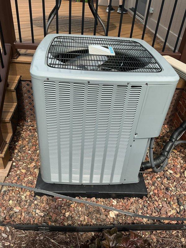 Completed comprehensive Gold AC Inspection on residential split system with outdoor condenser unit installed in 2023 and furnace located in basement. Performed thorough visual inspection of exterior condenser unit, verified proper installation on pad with adequate clearance, checked refrigerant lines and electrical connections, and documented equipment condition through photographs. Unit found to be in good operating condition with no visible deficiencies noted.