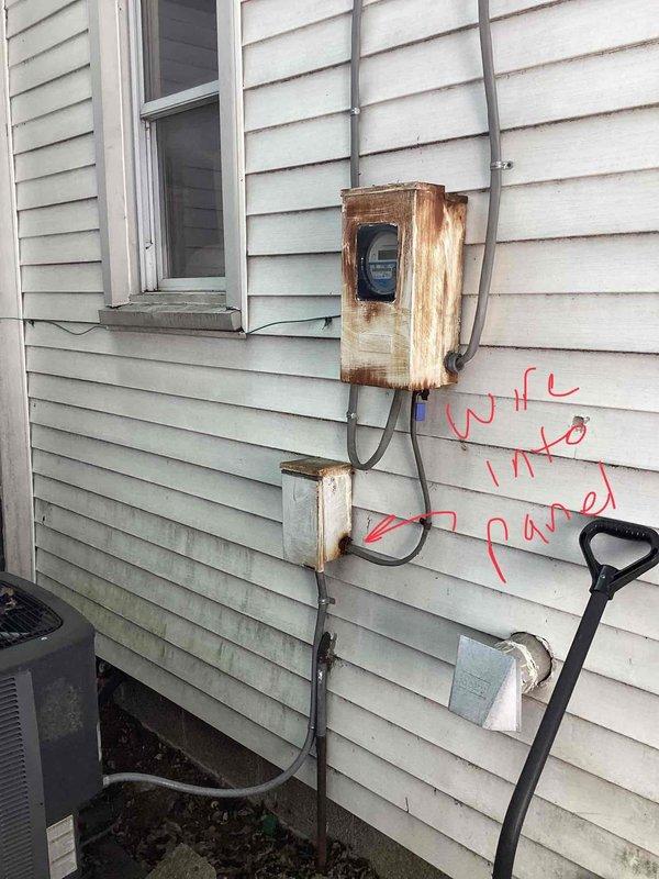 Responded to service call for air conditioning system with non-operational outdoor fan unit. Upon arrival, assessed 2015 AC system with evaporator coil located in basement and outdoor condensing unit mounted at exterior of residence. Conducted diagnostic evaluation to determine cause of fan failure while compressor continued to run. Inspected electrical connections at outdoor unit, noting weathered and rust-compromised meter enclosure and associated conduit requiring attention for proper system operation. Evaluated thermostat functionality and control wiring to rule out low-voltage control issues. Documented existing equipment condition including copper refrigerant line set routing from basement coil location to outdoor unit. Prepared comprehensive replacement estimate for customer consideration given age and condition of existing system components. Photographed current installation including thermostat location, exterior electrical service connections, and outdoor unit positioning for