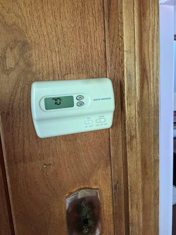 Completed comprehensive Gold AC inspection on single-unit residential system less than 10 years old with Lennox furnace and air handler located in basement. Verified White-Rodgers thermostat operation at 70°F setpoint, inspected all HVAC equipment including furnace, air handler cabinet, ductwork connections, and PVC condensate piping. System confirmed operational with no deficiencies noted; all components functioning within normal parameters.
