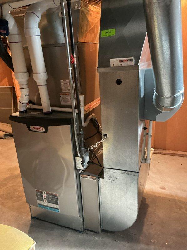 Completed comprehensive Gold AC inspection on single-unit residential system less than 10 years old with Lennox furnace and air handler located in basement. Verified White-Rodgers thermostat operation at 70°F setpoint, inspected all HVAC equipment including furnace, air handler cabinet, ductwork connections, and PVC condensate piping. System confirmed operational with no deficiencies noted; all components functioning within normal parameters.