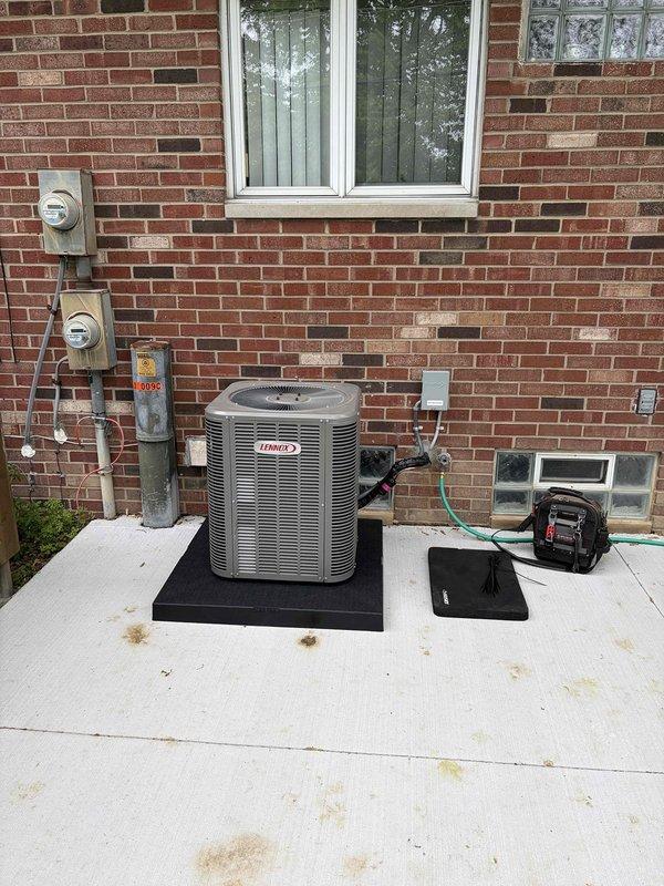 Completed AC reconnect service on approximately 1-year-old Lennox outdoor condensing unit. Successfully reconnected electrical service, verified proper operation of compressor and condenser fan motor, and confirmed system startup with refrigerant pressure diagnostics showing normal operating parameters.