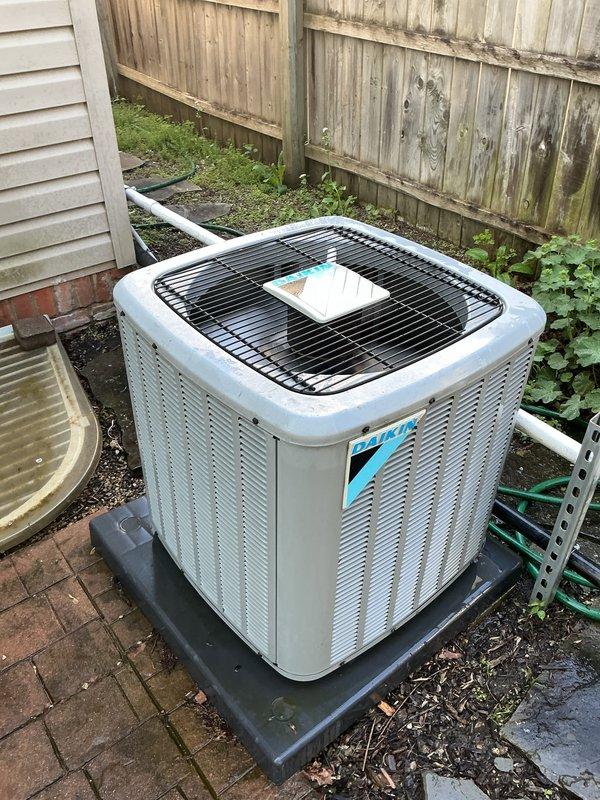 Completed comprehensive Gold AC inspection on 8-year-old residential air conditioning system with outdoor condensing unit and basement air handler. Performed visual inspection of exterior condensing unit, verified proper placement on pad, checked refrigerant line connections and condensate drainage system. Conducted electrical diagnostics using clamp meter to test amperage draw, verified capacitor ratings at 45/5 MFD, inspected all electrical connections and wiring for proper operation. System found to be operating within normal parameters with no immediate service needs identified.