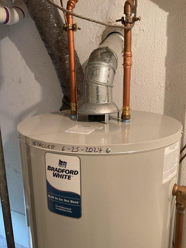 Completed comprehensive Gold AC inspection on residential system less than one year old. Performed full system evaluation including outdoor condenser unit positioned on concrete pad alongside building exterior, verified proper operation of all components, checked refrigerant lines and electrical connections, and inspected air handler/coil assembly located in basement. System found to be operating within normal parameters with no deficiencies noted. Provided MERV 8 filters as requested and documented equipment condition through photographic records showing well-maintained outdoor unit with clean coil surfaces and proper clearances.