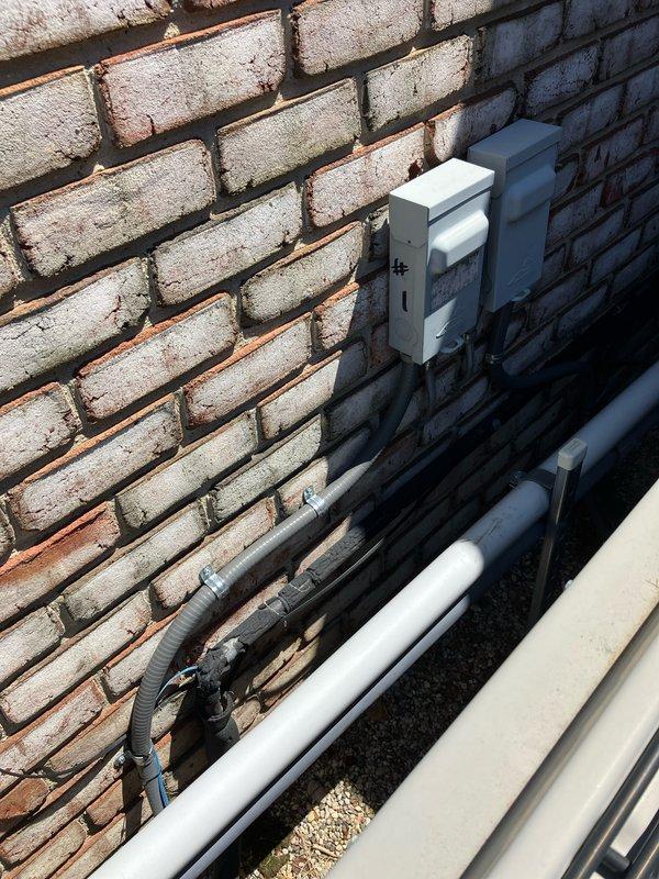 Conducted comprehensive inspection and prepared replacement estimate for 10-year-old AC unit #1 located in basement. Evaluated existing outdoor condensing units positioned against brick exterior wall with proper electrical disconnect and drainage systems in place. Assessment included indoor air quality concerns with specific request for CO2 level testing. Equipment currently operational at time of inspection, allowing for thorough performance evaluation and accurate replacement specifications.